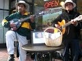 George Gange and Tomas Pan busking for Merlita's cause at the corner of Market and Embarcadero in SF