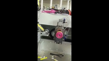 Automatic back to back hook and loop tape winding cutting labeling machine