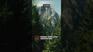 Why does water boil at a lower temperature on top of a mountain?