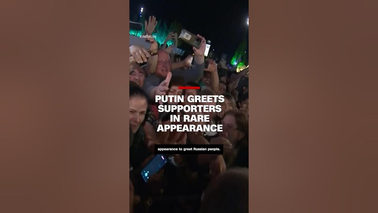 Putin greets supporters in rare appearance