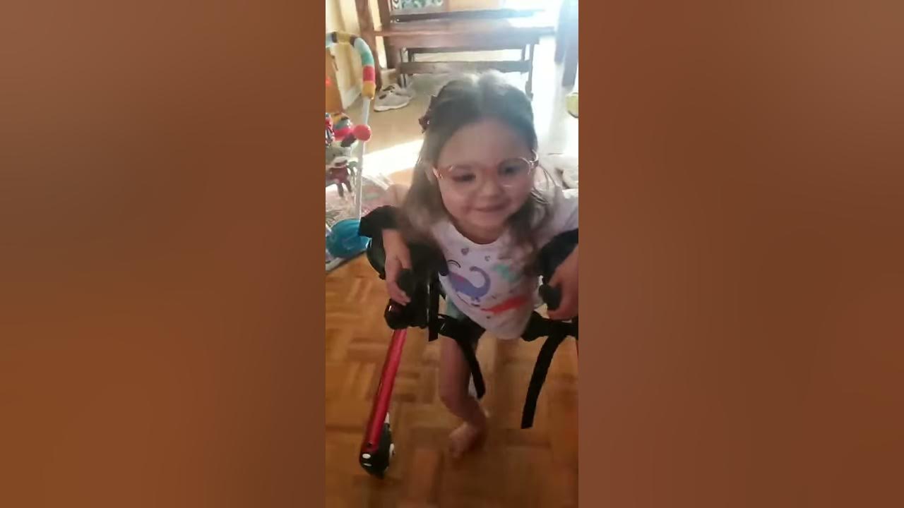 Little Girl With Cerebral Palsy Practices Walking Without Help From Mom For First Time