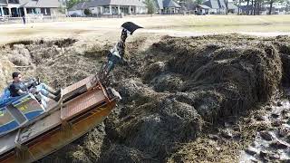 Truxor T50 , Climbing Pile Of Primrose Roots And Pulling It Down To Dry And Decompose