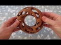 Toroidal ball-in-a-cage design, carved from Xylia (Zambezi ash)