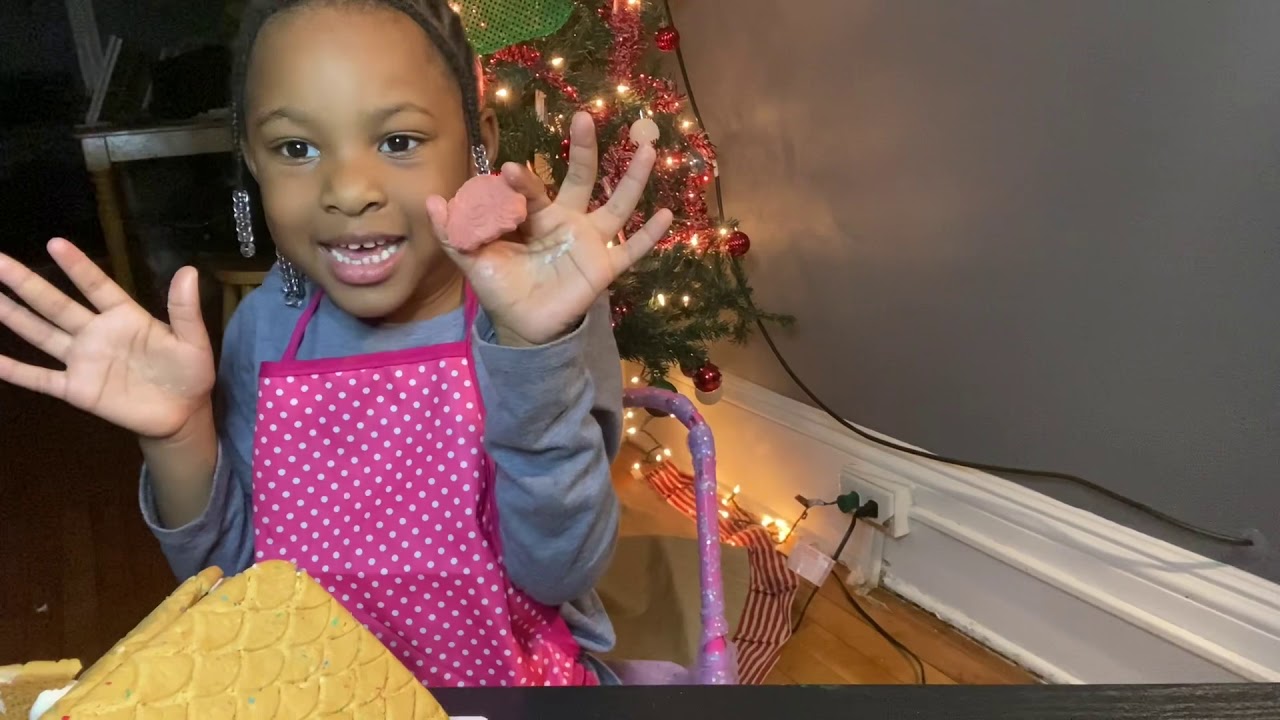 Jordyn builds her 1st (trolls) gingerbread house!!!
