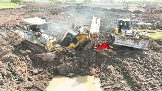 Download Lagu This intense rescue operation, multiple bulldozers work together in deep, sticky mud by carefully MP3