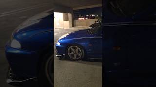 nice pair of jdm r33 nissan skyline gtrs leaving car meet