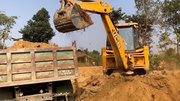 Loading Soil With Backhoe Loader In Tripper Dump Video