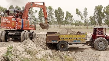 Fiat Alghazi vs Messi Tractor loading and unloading Soil Trollies loaded by Excavator