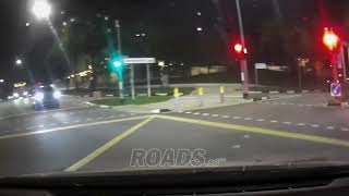 A food delivery rider dashed across the road diagonally, nearly causing a collision.
