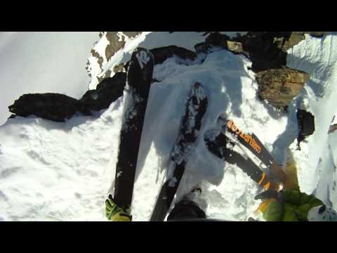 raw helmet cam footage: Skier falls off huge rocky cliff and SURVIVES