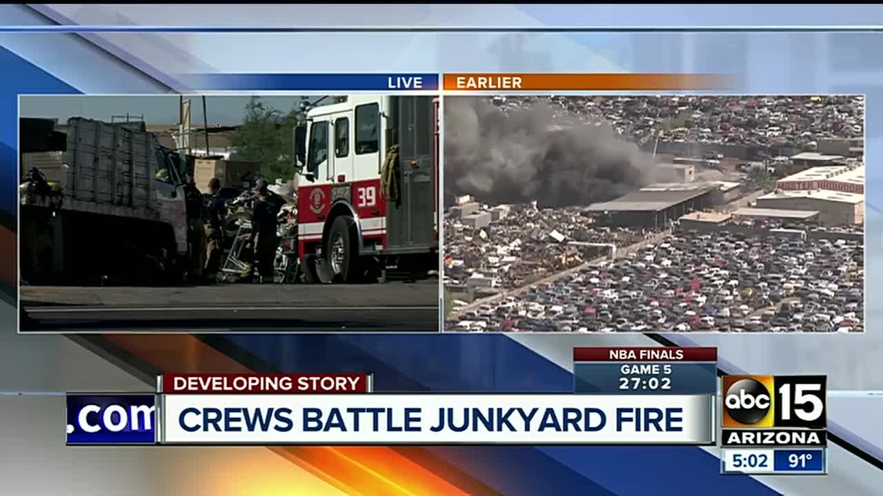 Fire crews battle first-alarm fire at a junkyard in Phoenix - YouTube