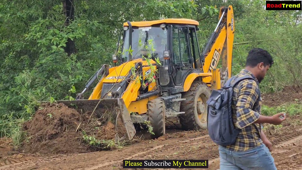 Jcb Backhoe pushing mud