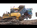 Bulldozer Pushing Clearing Mud And Dump Truck Extremely unloading Dirt