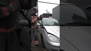 Lifting car hood with Forcible Entry Tool T1