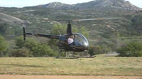 Todd & Marcia flying in the R22 @ Qual Gulch Ranch...