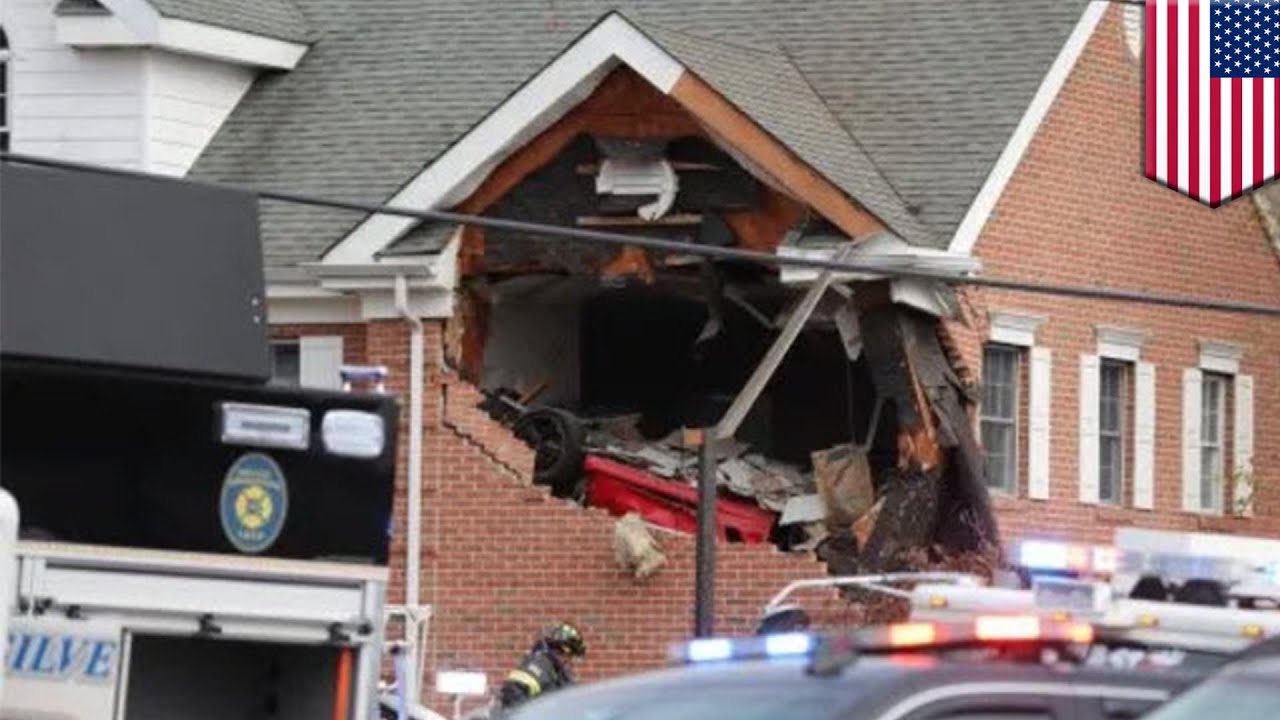 Porsche goes airborne into 2nd story of building - TomoNews