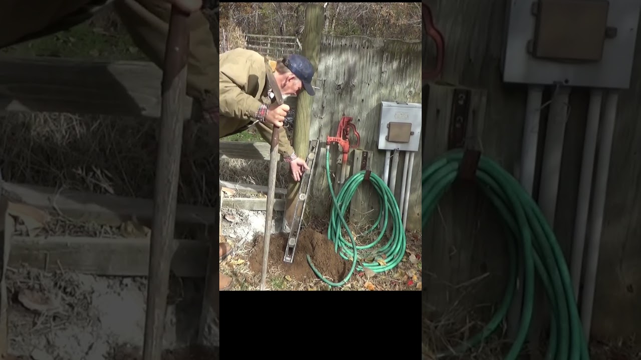 Setting the new garden gate post 