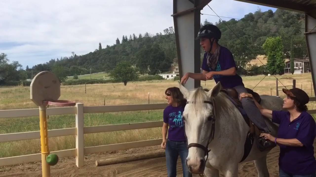 Horseback riding therpy helps those with mental, physical disabilities