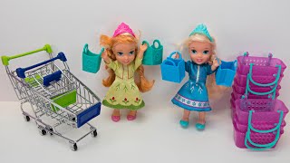 Elsa and Anna toddlers shopping for dolls