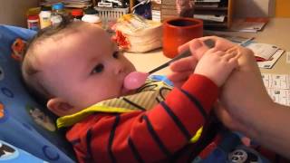 Ethan eating cereal for the 1st time (2)