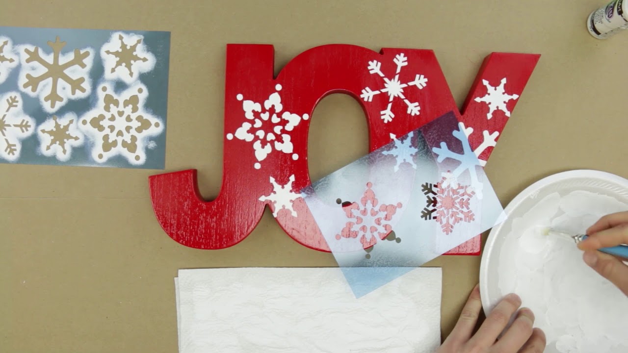 Stencil Snowflakes on Windows with Temporary Snow Frost