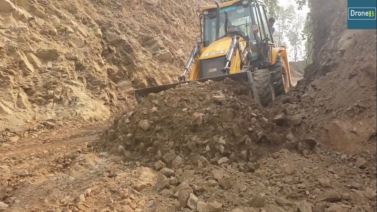 Backhoe Loader-Removing Hilly Road Dirt after Excavator Cutting Hill
