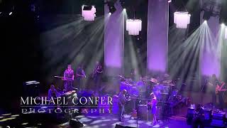 Live -SOLO Close UP Midnight in Harlem w/Little Martha Intro Tedeschi Trucks Band-Mann Music Center
Tedeschi Trucks Band Performs Midnight in Harlem Live at the Mann Music Center in Philadelphia for the Deuces Wild Tour of 2024.
Here’s the set up.
New iPhone pro max 15 ,
Filmic app to control the iPhone lenses and shutter speed ,
Sorry for some of the technical difficulties on my end , first row balcony is a great spot, it’s just not quite as close as you think or hope.
This is towards the end of the set, and even though it was a great night, the weather was a little difficult. The breeze was really minimal. I don’t know how the band does it, Derrick with his long pants, boots and long sleeve shirt, every time.
This is the best I could do from my Distance handheld. It’s pretty decent, but there are a couple rough spots. I wasn’t the only one having some technical difficulties. I had to mess extensively with the sound. I don’t know exactly what was going on, but there was some unfortunate sound difficulties during that performance of midnight in Harlem.
Tedeschi trucks band was rocking and hot all night long and you could tell just by the expressions on their faces that they were pleased with their performance.
I do have a video at the end of the show where I get down in the first few rows, I will post that later.
The Intro teases with Little Martha, The Sax dude goes crazy for 2 minutes and As always, Derrick knocks the solo out of the park, with some unique moments. Susan really belts out the final line of midnight and Harlem with her shiny boots, 👢 those sparkly things really help rock out.
A great time as always seeing them live.
I hope you enjoy the video. Live -SOLO Close UP Midnight in Harlem w/Little Martha Intro Tedeschi Trucks Band-Mann Music Center