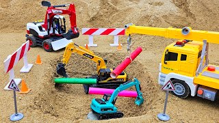 Rescue the truck from the pit with excavator and crane truck