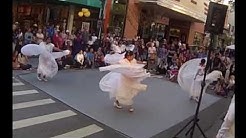 Troupe of dancers performing a Mexican folk dance.
