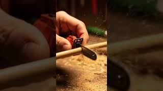 A Tiny Chainsaw Orange Cut Bamboo Stick