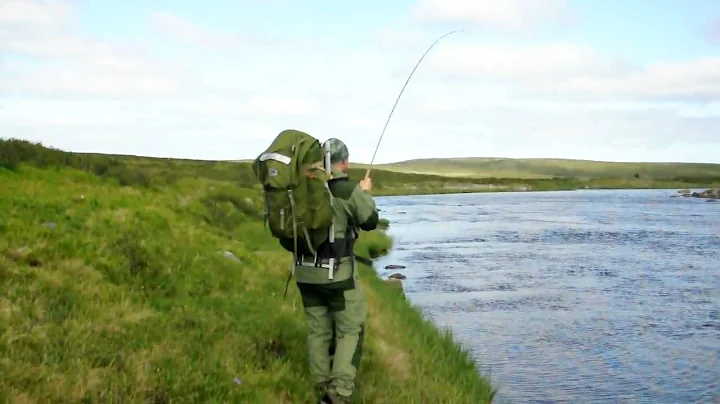 Drilling a big brown trout in Litza, Kola