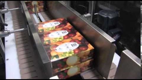 Stacking Cartons and Shrink Wrapping In Total Closure