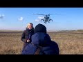 Dangerous mi24 hind attack helicopter passes over the reporters head