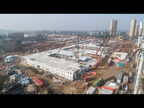 First Wuhan coronavirus hospital foundation concrete 95% complete, protective polyethylene installed