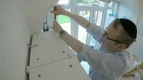 Putting up Ikea bookshelf extensions with the A-Team