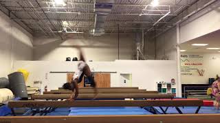 Back handspring layout step out on beam