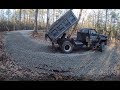 Delivering gravel to a muddy driveway