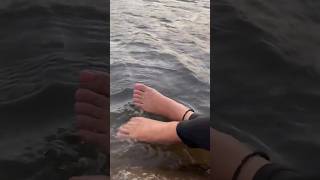 Feet With Black Thread Tied Around Ankles