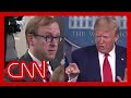 Trump berates reporters when asked about report by his official