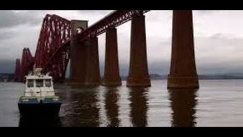 Winter Passenger Train Crossing Forth Railway Bridge On Visit To South Queensferry Scotland