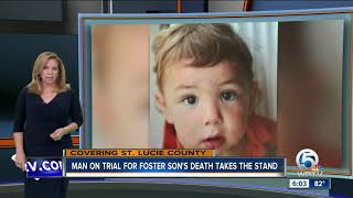 Man charged with killing foster son takes stand
