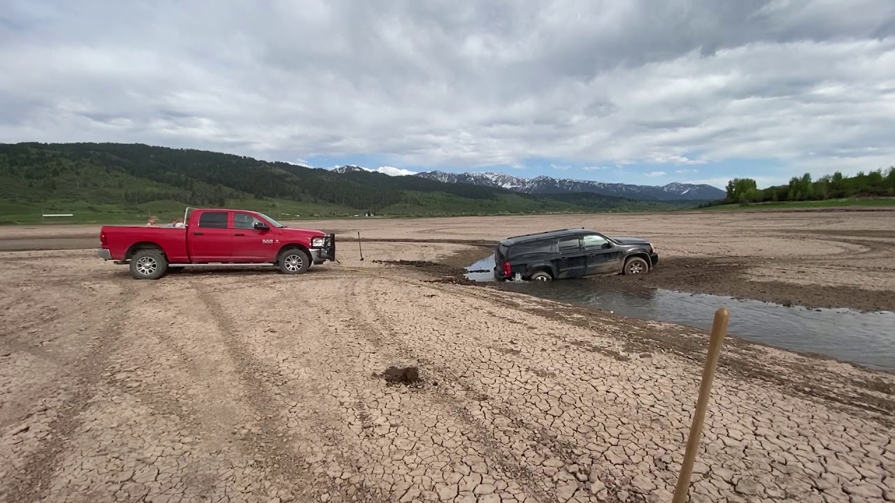 Ram With Cummins Diesel Pulls Out a Stuck Chevy Suburban! - YouTube