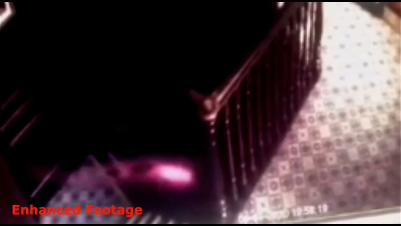 Red glowing spirit Orb triggers security camera in english pub.