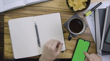 Man Scrolling On Smart Phone with Green Screen