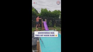 Adventurous man tries out kiddie slide