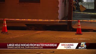 Massive sinkhole opens up after water main break in Camp Washington