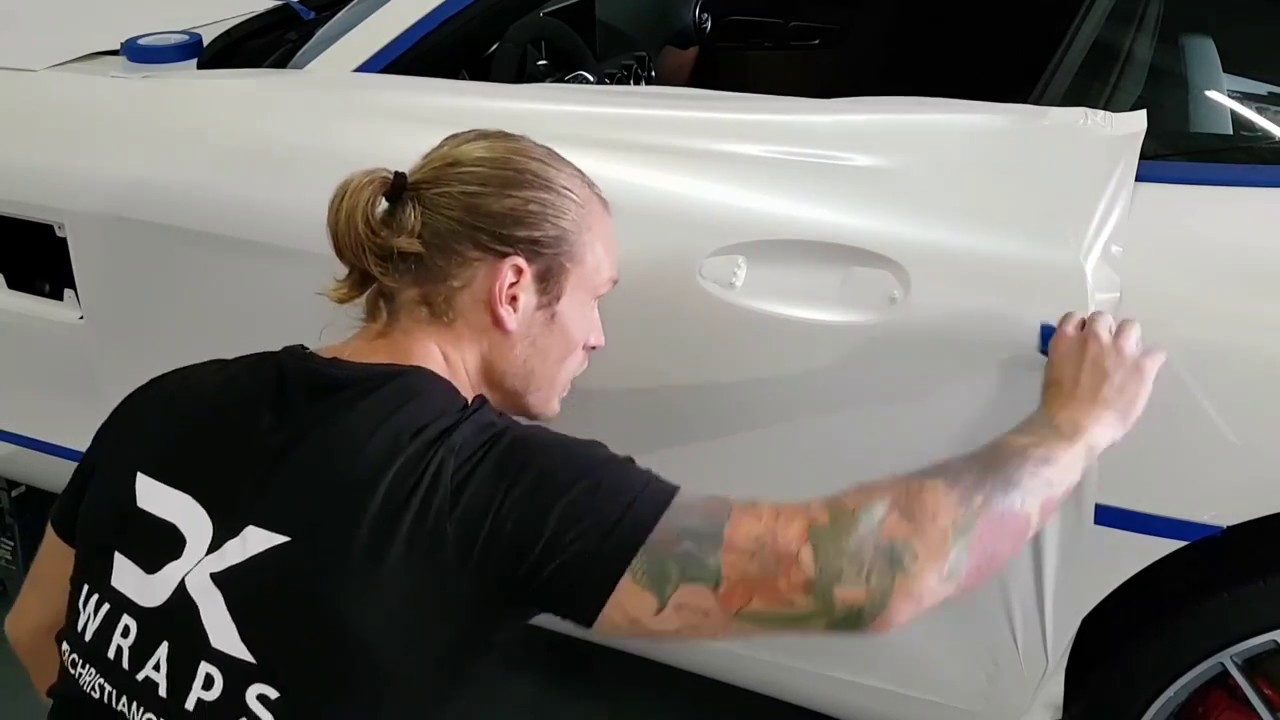 Mercedes GTS vinyl wrap door. Using Avery satin pearl white by @ckwraps www.ckwrapsmiami.com