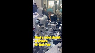Meet a robot pianist at Chinas Hi-Tech Fair