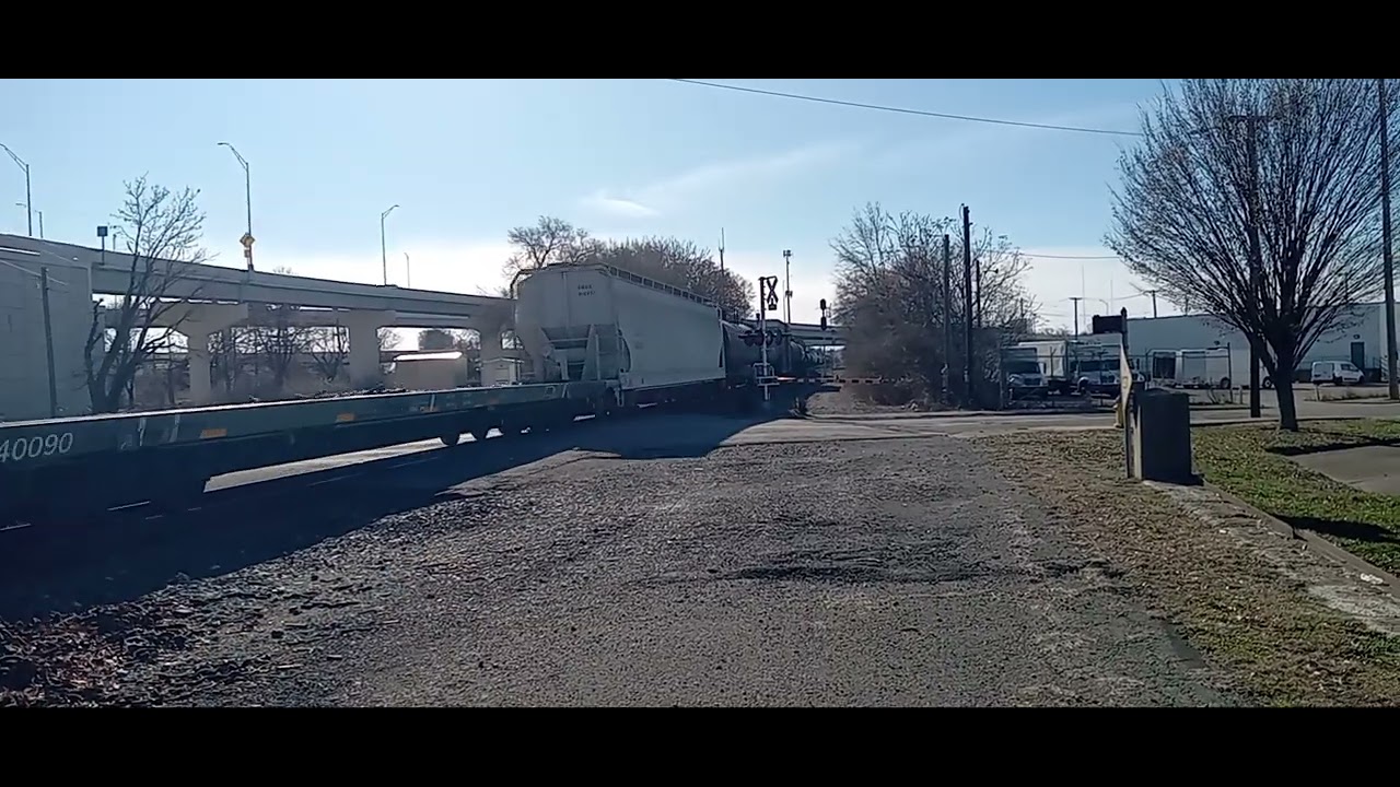 CSX M506 passing through the highway bridge. 