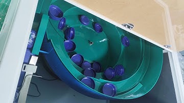 operation demo caps bowl feeding system for cap labeling machine -- South African customer